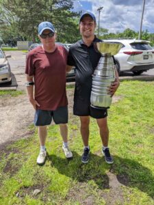 Brendan and Tom holding the 2022 “Stanley Cup”